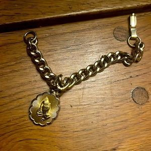 Bracelet with prayer hands On one side and the serenity prayer on the other